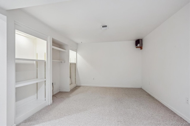 unfurnished bedroom with light colored carpet