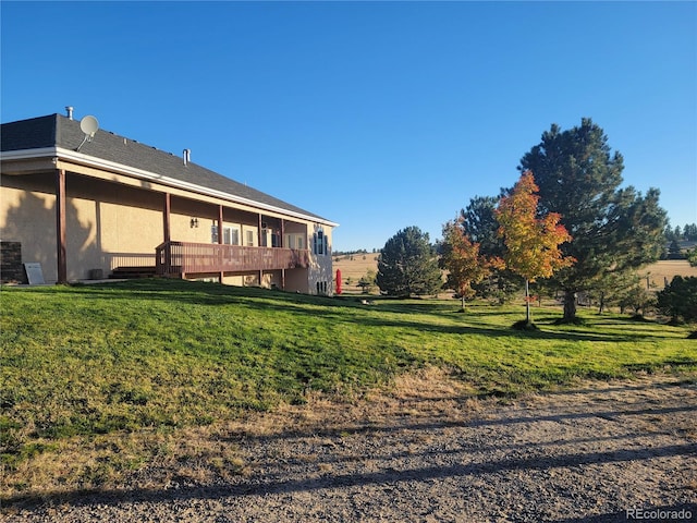 view of yard featuring a wooden deck