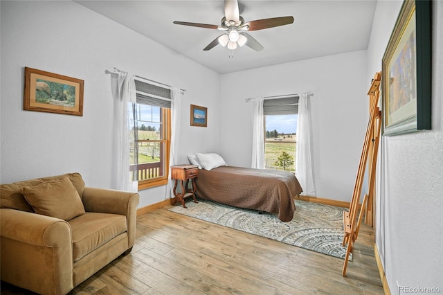 bedroom featuring ceiling fan and light hardwood / wood-style floors