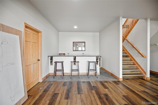 unfurnished dining area featuring dark hardwood / wood-style floors