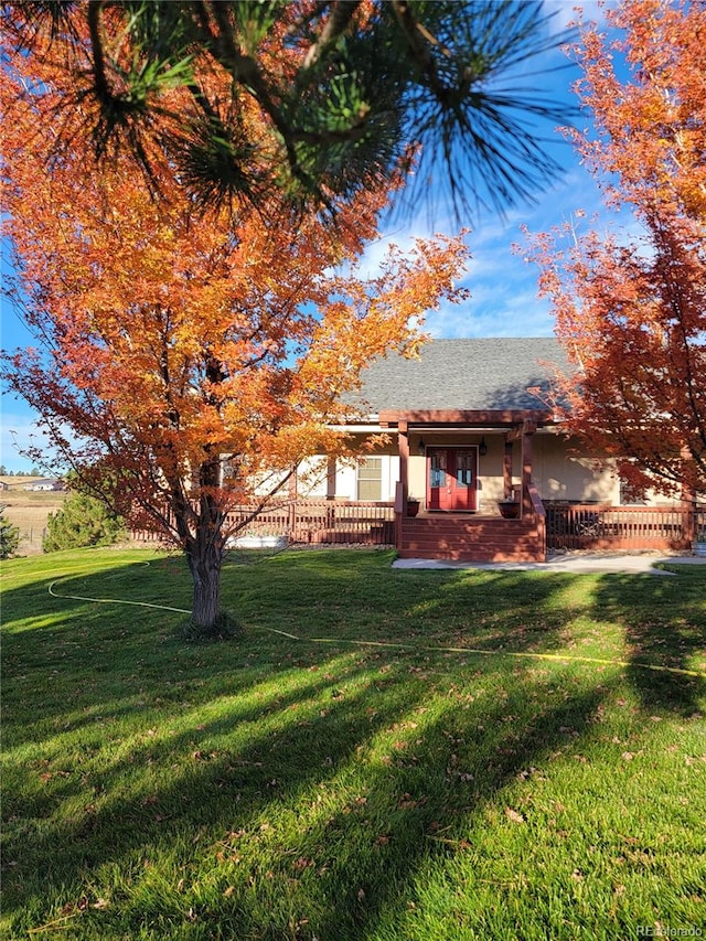 exterior space with a front yard