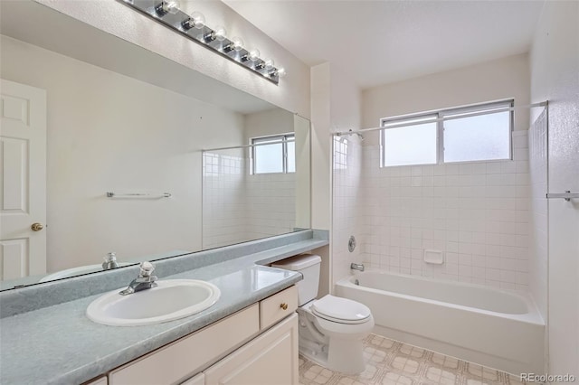 full bathroom featuring vanity, toilet, and tiled shower / bath combo