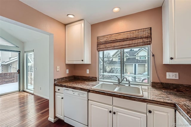 kitchen featuring sink, white cabinets, dark wood-type flooring, and white dishwasher