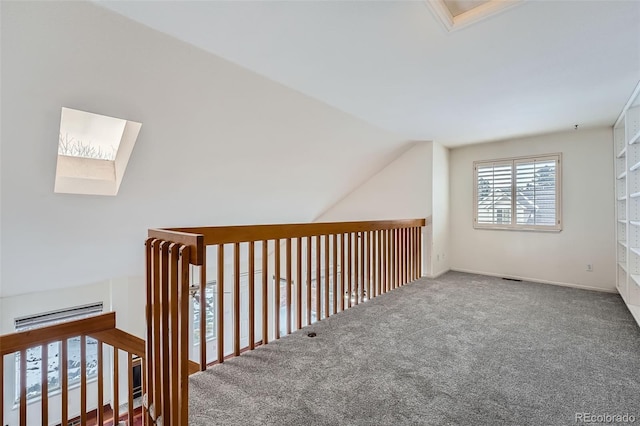 2121 S Troy Way, Aurora, CO 80014 - bonus room featuring vaulted ceiling, a skylight, and carpet floors
