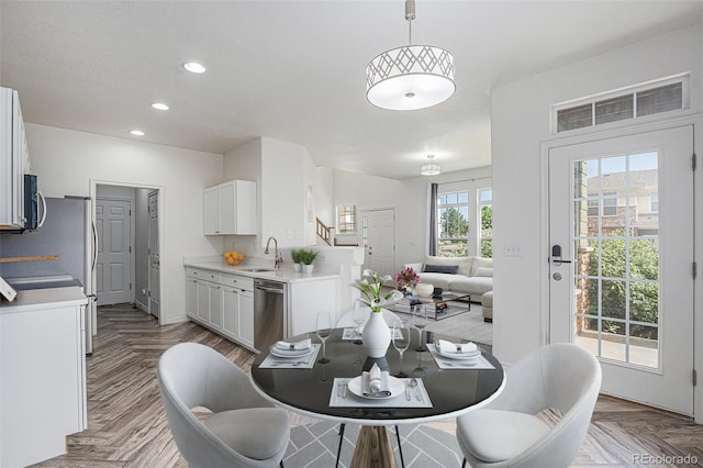 3000 E 112th Ave Unit 61, Northglenn, CO 80233 - dining room with stairs and recessed lighting