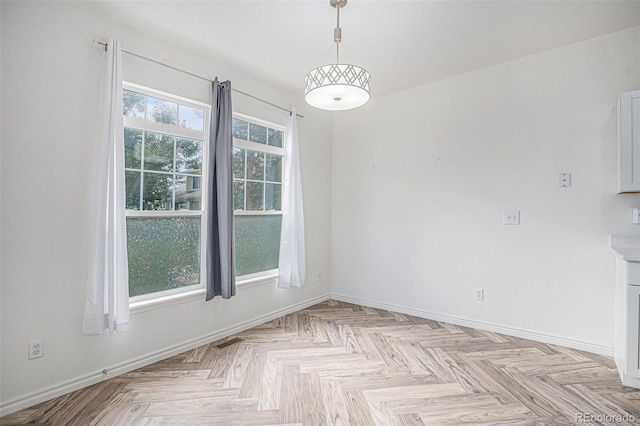 3000 E 112th Ave Unit 61, Northglenn, CO 80233 - unfurnished dining area featuring baseboards