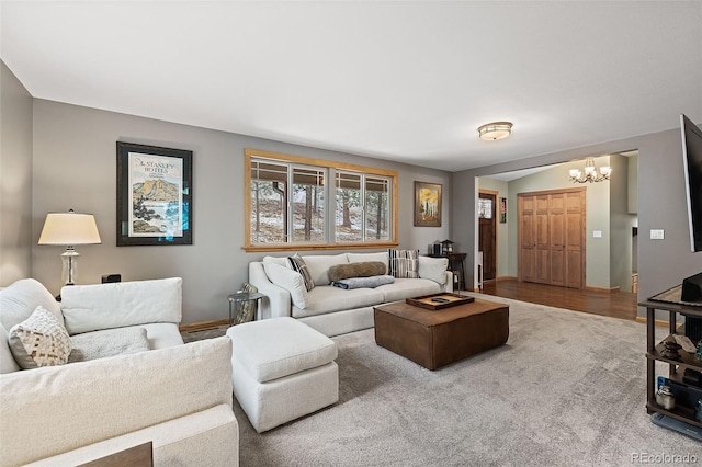 2857 Hiwan Dr, Evergreen, CO 80439 - living room with carpet, a notable chandelier, and baseboards