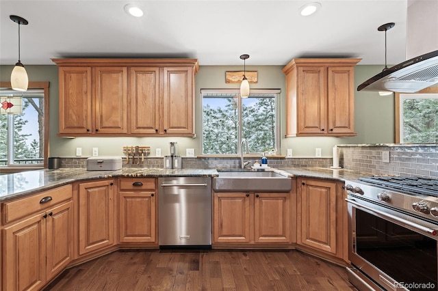 2857 Hiwan Dr, Evergreen, CO 80439 - kitchen with recessed lighting, dark stone countertops, dark wood-style flooring, a sink, and stainless steel appliances