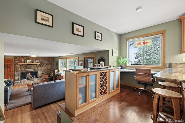 2857 Hiwan Dr, Evergreen, CO 80439 - interior space featuring a fireplace and dark wood-type flooring