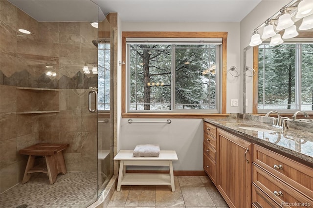 2857 Hiwan Dr, Evergreen, CO 80439 - full bath featuring a shower stall, vanity, and baseboards