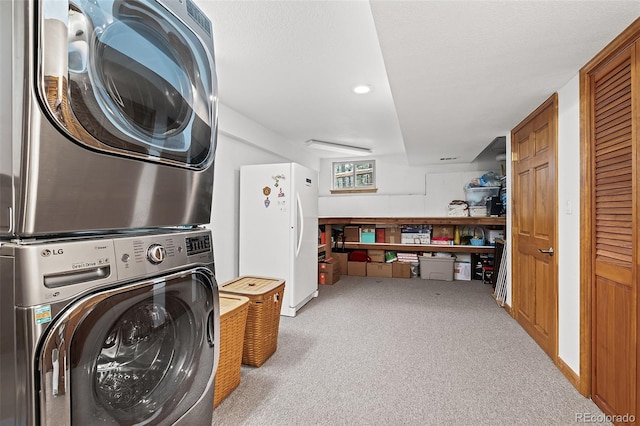 2857 Hiwan Dr, Evergreen, CO 80439 - laundry area featuring stacked washer / dryer, laundry area, recessed lighting, and carpet floors