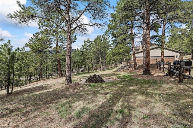 2857 Hiwan Dr, Evergreen, CO 80439 - view of yard with an attached garage and fence
