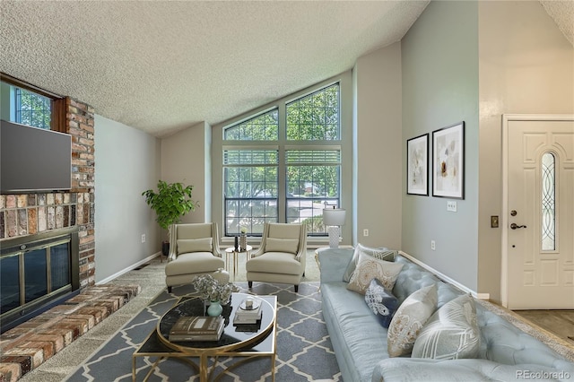 8164 Flower Cir, Arvada, CO 80005 - living room featuring a textured ceiling, baseboards, a fireplace, and high vaulted ceiling