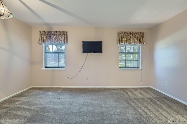 8164 Flower Cir, Arvada, CO 80005 - spare room featuring healthy amount of natural light, carpet, and baseboards