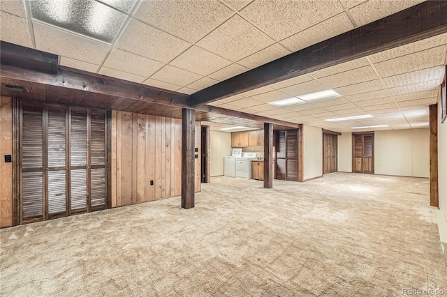 8164 Flower Cir, Arvada, CO 80005 - finished basement with a drop ceiling, separate washer and dryer, carpet flooring, and wood walls