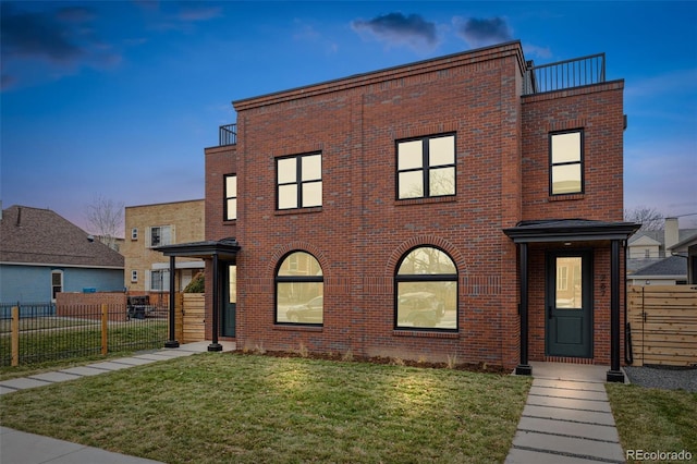 view of front of home with a yard