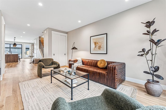 living room with light hardwood / wood-style floors