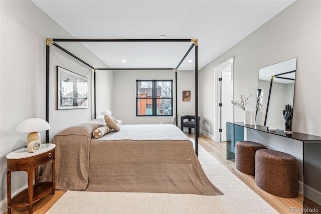 bedroom with light wood-type flooring