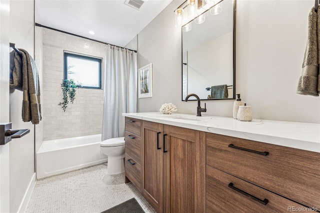 full bathroom with tile patterned flooring, vanity, toilet, and shower / bath combo with shower curtain