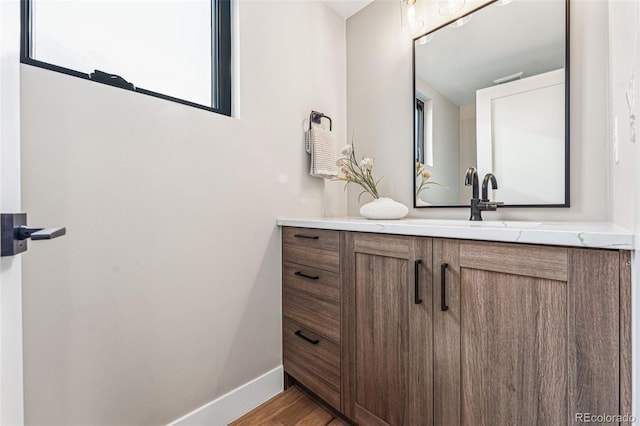 bathroom featuring vanity and hardwood / wood-style flooring