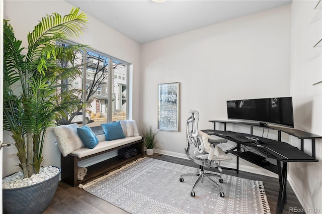 home office with dark hardwood / wood-style flooring