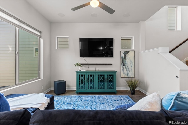 living room featuring hardwood / wood-style flooring and ceiling fan