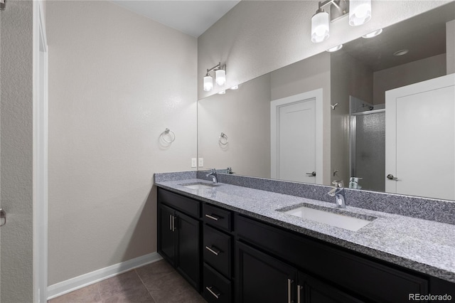 bathroom with vanity, tile patterned floors, and walk in shower