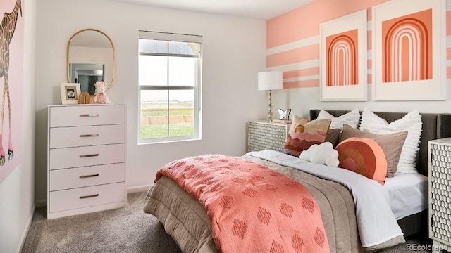 bedroom featuring carpet floors and multiple windows