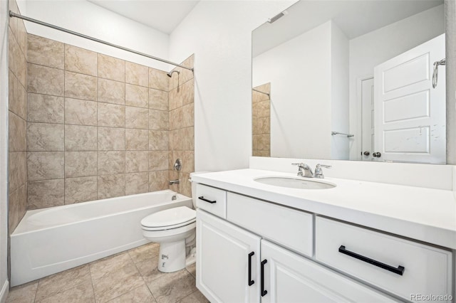 full bathroom with washtub / shower combination, vanity, toilet, and tile patterned floors