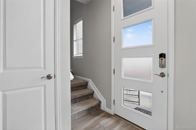 19629 W 93rd Dr Unit C, Arvada, CO 80007 - foyer featuring light wood-style flooring and stairs