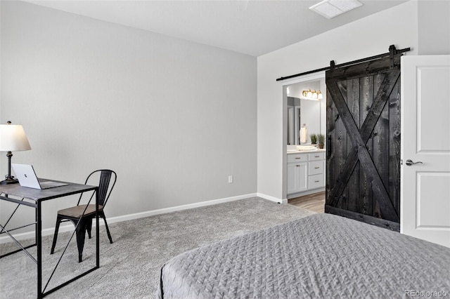 19629 W 93rd Dr Unit C, Arvada, CO 80007 - bedroom with light carpet, a barn door, and ensuite bath