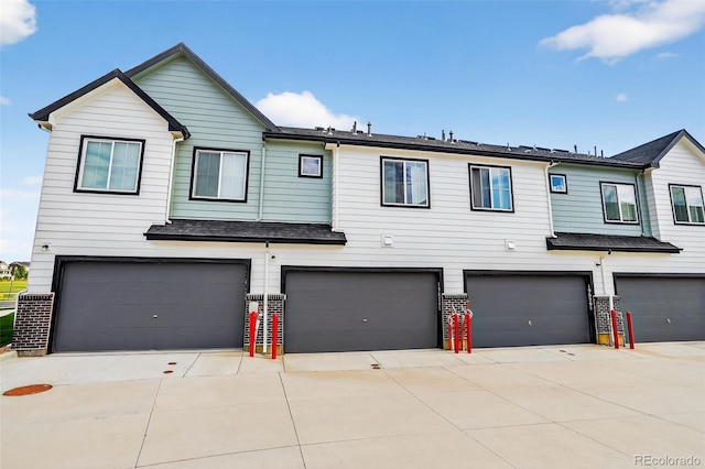 19629 W 93rd Dr Unit C, Arvada, CO 80007 - view of property featuring an attached garage