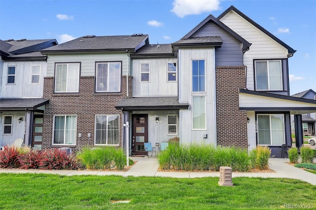19629 W 93rd Dr Unit C, Arvada, CO 80007 - multi unit property with brick siding and a front lawn