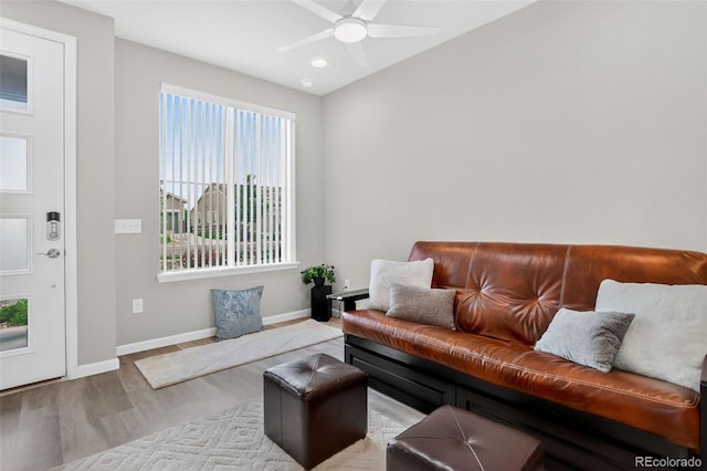 19629 W 93rd Dr Unit C, Arvada, CO 80007 - living area featuring wood finished floors and a ceiling fan