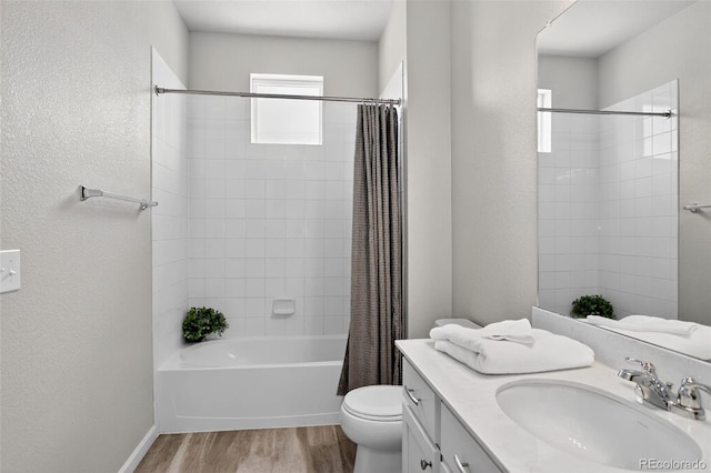 19629 W 93rd Dr Unit C, Arvada, CO 80007 - full bath featuring wood finished floors, vanity, shower / bathtub combination with curtain, and a textured wall