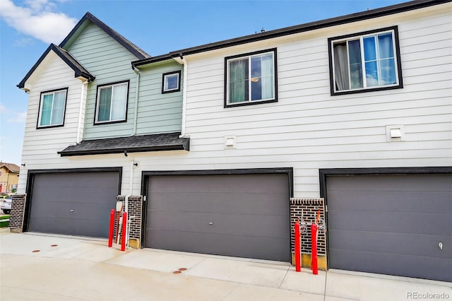 19629 W 93rd Dr Unit C, Arvada, CO 80007 - view of property with an attached garage