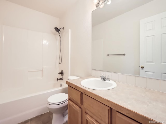 bathroom with vanity, toilet, bathtub / shower combination, and tile patterned flooring