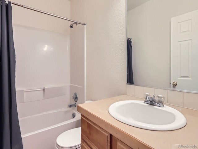 bathroom featuring toilet, vanity, and shower / tub combo with curtain