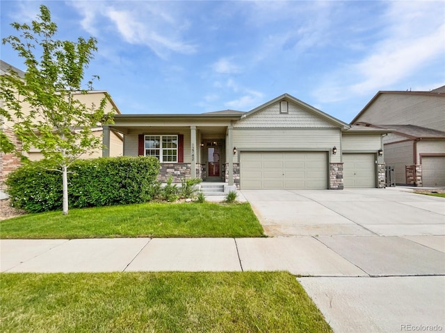 12742 E 104th Dr, Commerce City, CO 80022 - view of front of property featuring an attached garage, driveway, a front lawn, and stone siding