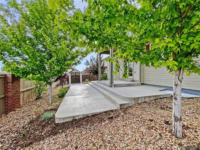 12742 E 104th Dr, Commerce City, CO 80022 - fenced backyard with a patio area
