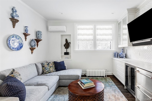 living room with radiator heating unit, crown molding, beverage cooler, and a wall unit AC