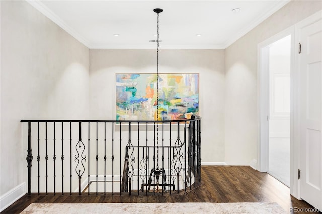 hallway with ornamental molding and dark hardwood / wood-style flooring