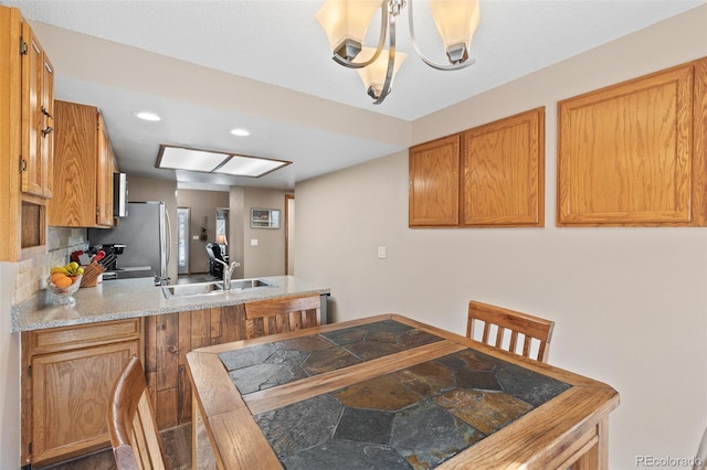 7624 S Cove Cir, Centennial, CO 80122 - dining area featuring stone finish flooring, recessed lighting, and a chandelier