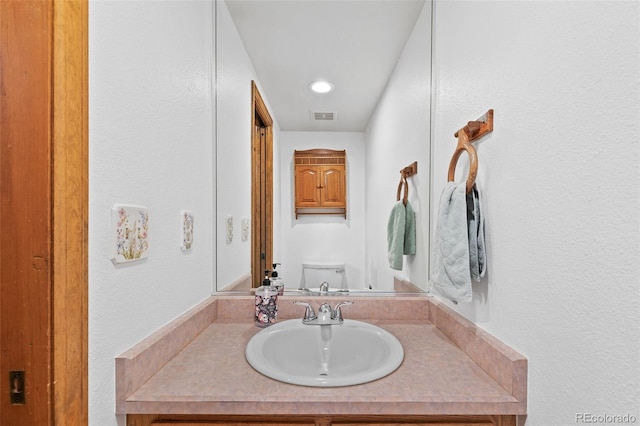 7624 S Cove Cir, Centennial, CO 80122 - bathroom featuring vanity and toilet