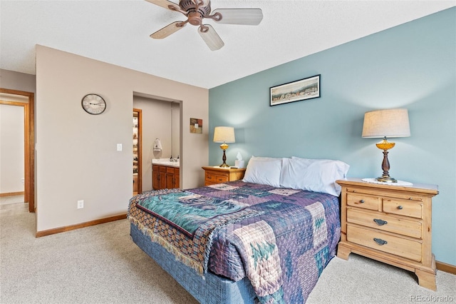 7624 S Cove Cir, Centennial, CO 80122 - carpeted bedroom featuring a ceiling fan and ensuite bathroom