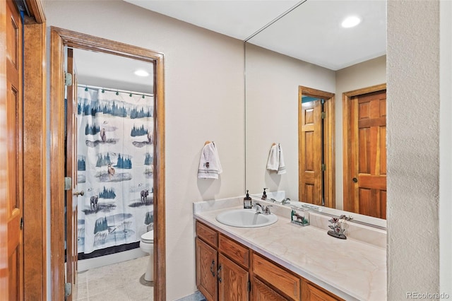 7624 S Cove Cir, Centennial, CO 80122 - full bath with vanity, a shower with shower curtain, recessed lighting, and tile patterned floors