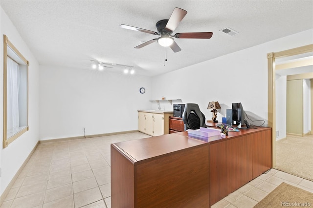 7624 S Cove Cir, Centennial, CO 80122 - home office with light tile patterned floors, a ceiling fan, track lighting, and a textured ceiling