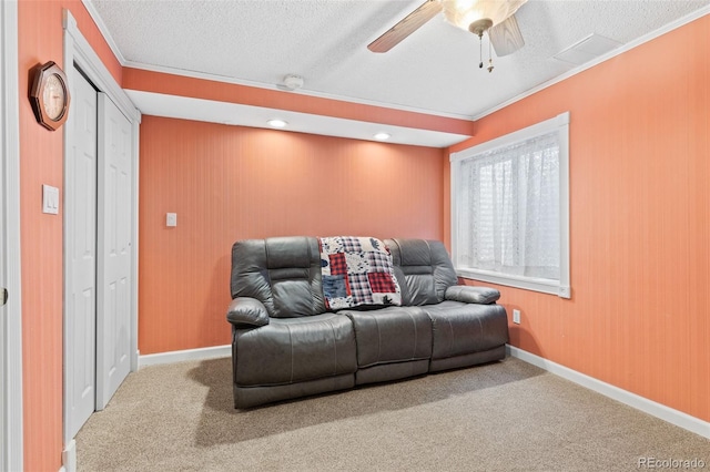 7624 S Cove Cir, Centennial, CO 80122 - carpeted living room with a textured ceiling, a ceiling fan, ornamental molding, and wooden walls