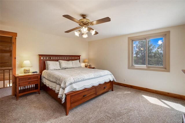 688 Obsidian Dr, Florissant, CO 80816 - bedroom featuring light carpet, baseboards, and a ceiling fan