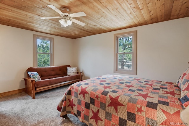688 Obsidian Dr, Florissant, CO 80816 - carpeted bedroom with multiple windows, wooden ceiling, a ceiling fan, and baseboards